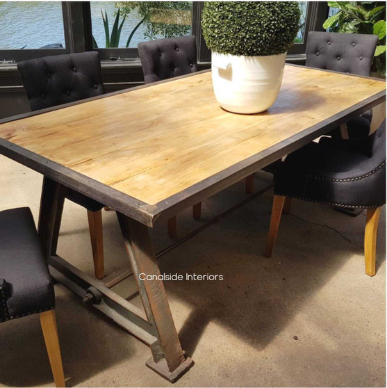 Showcasing the Industrial Mango Wood Tabletop with a metal border set against an urban chic backdrop, highlighting its sleek design.