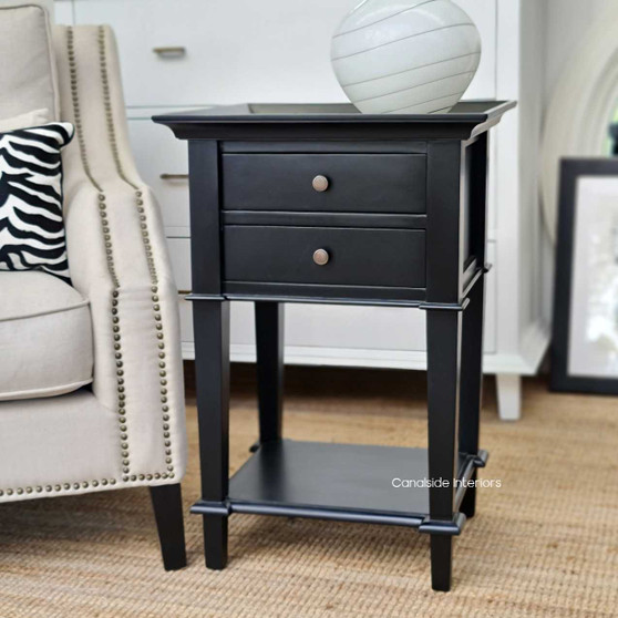 Frontal view of the Butler Small Side Table / Bedside in black, highlighting its Hamptons-inspired elegance and minor distressing.