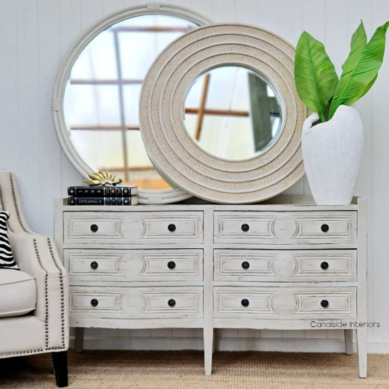 Frontal view of the Brielle Rattan Round Mirror Small at Canalside Interiors, showcasing its distinctive distressed stone frame and intricate rattan detailing.
