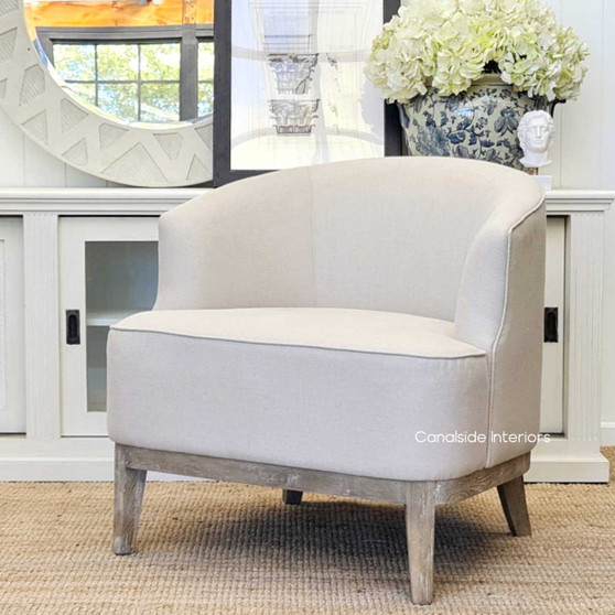 Elegant Hamilton Occasional Tub Armchair with cream upholstery, a Hamptons classic for a sophisticated Sydney living room - Canalside Interiors.