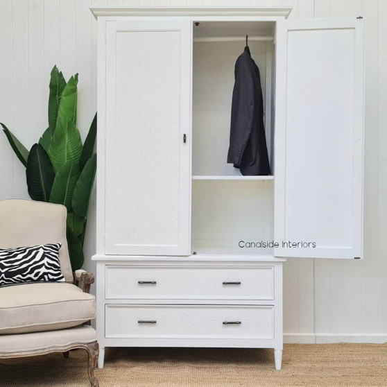 Interior shot of the wardrobe, featuring the hanging rod and adjustable shelves, perfect for versatile storage needs.