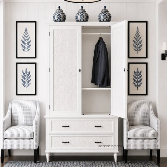Frontal view of the Brielle Rattan Wardrobe Cupboard in situ in white with door open, showcasing elegant white rattan detailing, storage and sleek design.