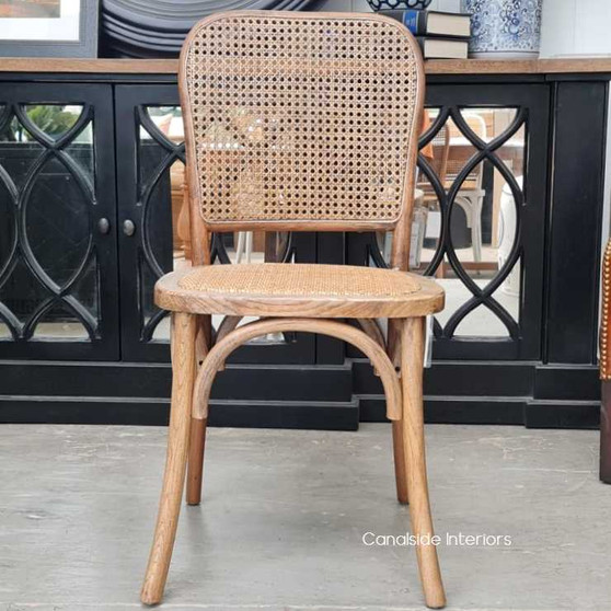 The Saxon Bentwood Chair in Burnished Oak offers a perfect blend of Hamptons sophistication and comfort for dining settings - Canalside Interiors.