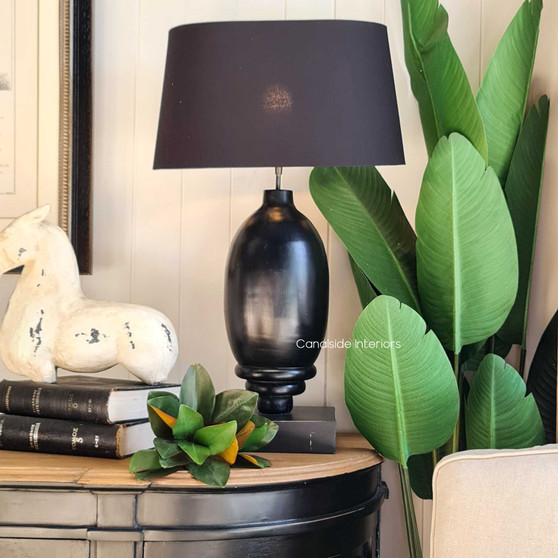 This black table lamp is perfect for adding a touch of drama to your home décor.