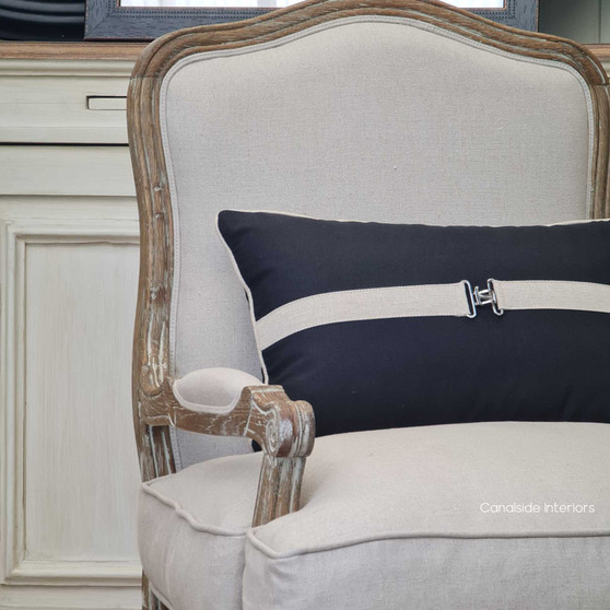 View of the Catelyn Armchair in cream, positioned as a sophisticated centerpiece in a Hamptons-style living room.