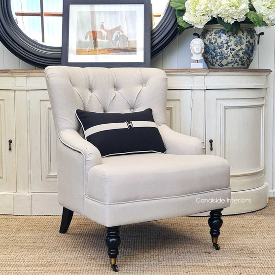 Frontal view of the Ascott Armchair, with its tufted back and comfortable seating, ready to enhance any living space with Canalside Interiors' signature style.