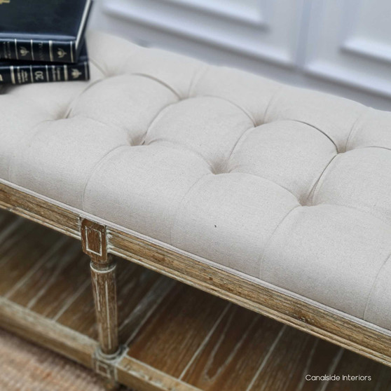 Elegant Providence Bed Ottoman in cream upholstery, set within a French Provincial-inspired bedroom, enhancing the space with its timeless design.