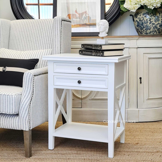The Hampton Avenue 2 Drawer Bedside Table in white, with its Hamptons styling, offers elegant bedroom storage - Canalside Interiors