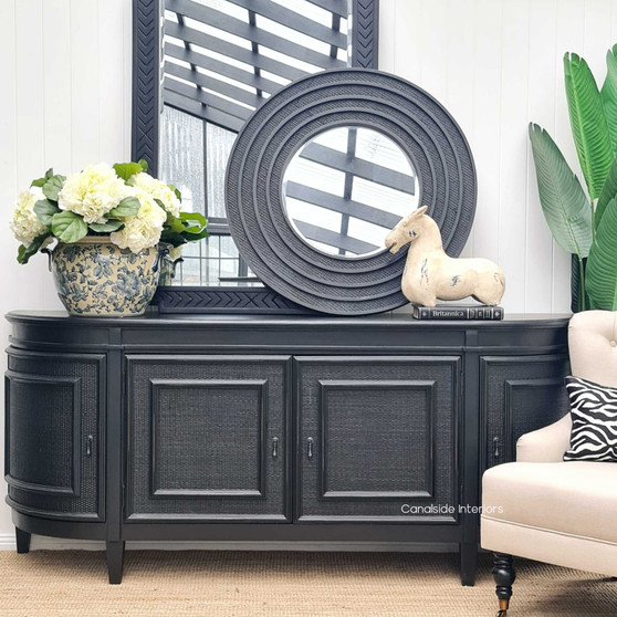 The Francia Rattan Sideboard, with its elegant distressed black/charcoal finish, brings a stately presence to any bedroom, courtesy of Canalside Interiors