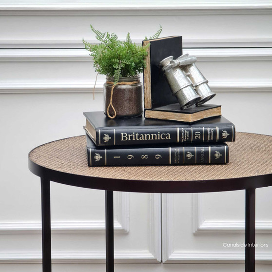 The Knox Rattan Nesting Coffee Tables, with their chic tempered glass and natural rattan tops, are a versatile choice for a Hamptons-style living room – Canalside Interiors.