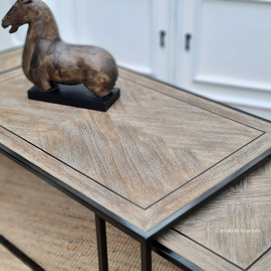 Main view of the Brienne Herringbone Nesting Coffee Table in distressed weathered oak, showcasing its modern and versatile design.