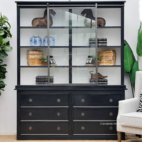 The Pemberley Wall Unit front view, showing the contrast of distressed black/charcoal and white interior, embodying Hamptons sophistication