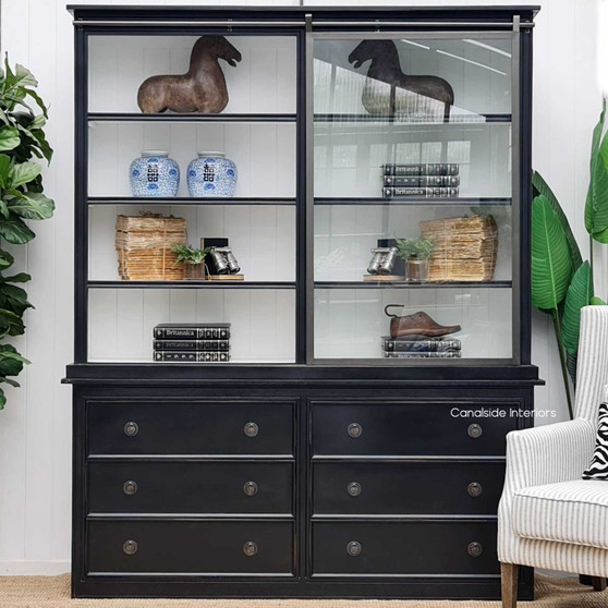 The Pemberley Wall Unit front view, showing the contrast of distressed black/charcoal and white interior, embodying Hamptons sophistication