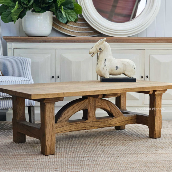 The Treadstone Oak Coffee Table, showcasing its chunky hardwood and rustic charm, is a standout piece for a Hamptons-style living room - Canalside Interiors