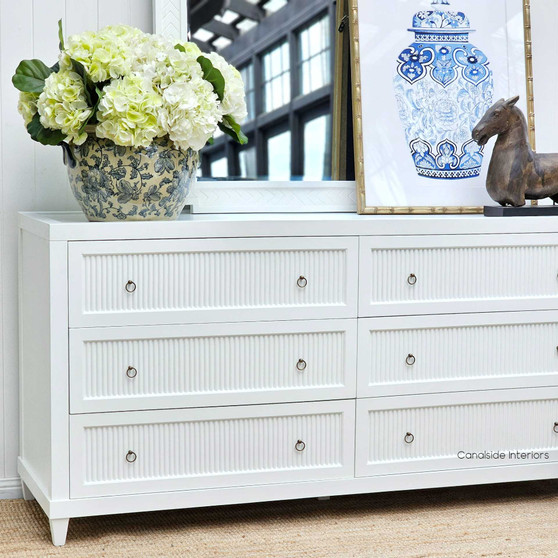Front view of the white Sorrento 6 Drawer Chest Grande, with ribbed detailing, ideal for a Hamptons-inspired bedroom - Canalside Interiors.