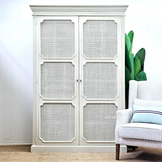 Front view of the Elendil Rattan Storage Cupboard in natural rattan, showcasing its rustic charm and modern Hamptons elegance for Canalside Interiors