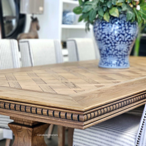 Angled perspective highlighting the table's ability to fit seamlessly into modern settings, at Canalside Interiors.