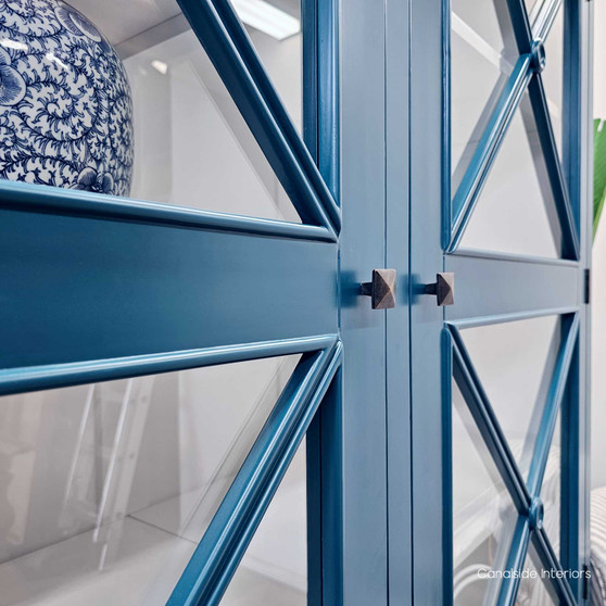 A full frontal view of the South Hamptons Wall Unit showcasing the elegant, modern lines and the vibrant teal green finish that adds a coastal vibe to the decor.