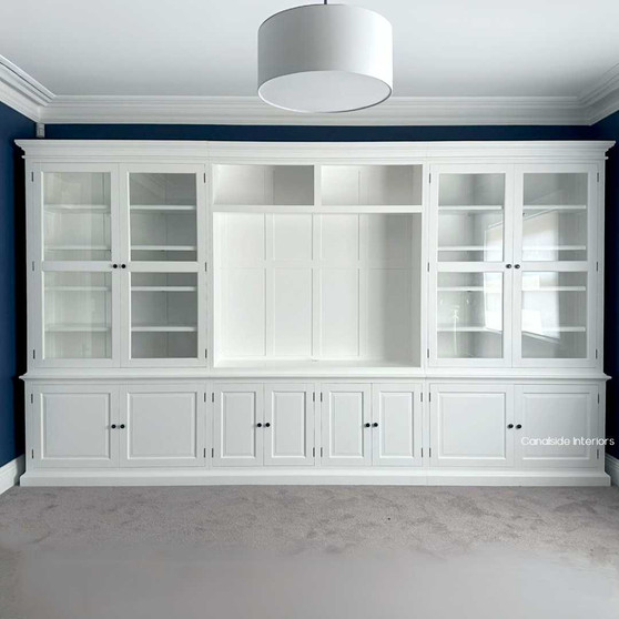 Elegant custom-made Casement Wall Unit in a living room with TV, featuring ample storage and high-quality materials for a sophisticated, organised look.