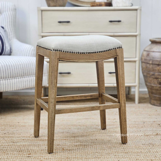 Side angle of the Mila Upholstered Kitchen Bar Stool, showcasing its elegant stud detailing and contemporary silhouette.