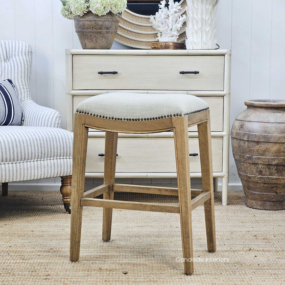 Side angle of the Mila Upholstered Kitchen Bar Stool, showcasing its elegant stud detailing and contemporary silhouette.
