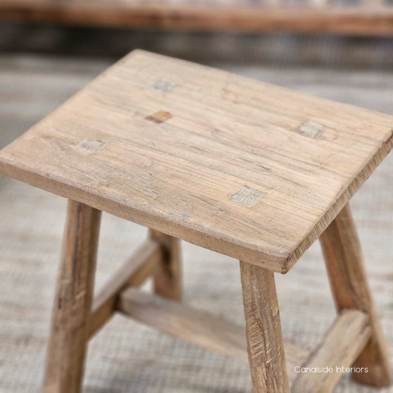 Side angle of the Vintage Teak Rectangular Stool, highlighting its sturdy legs and hand-finished detailing.