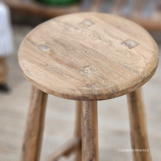 Side angle of the Vintage Teak Kitchen Stool, highlighting its sturdy legs and rustic teak wood grain.