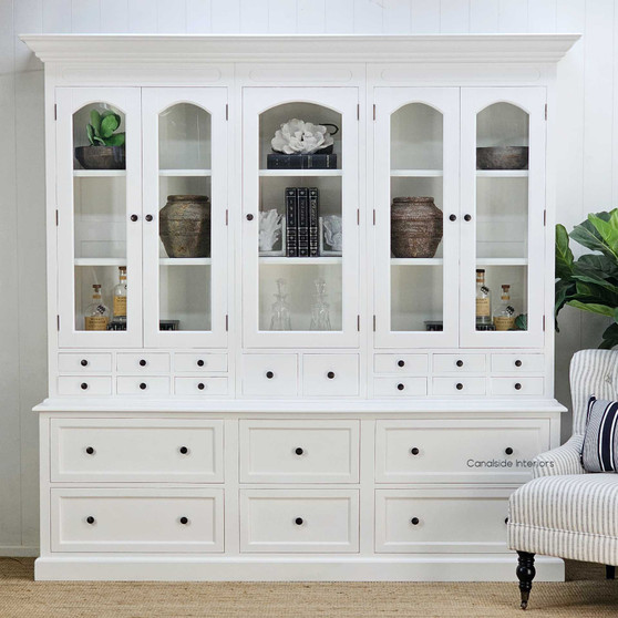 Full frontal image highlighting the five arched glass-panel doors and lower drawer layout. Elevate your dining room with the Key Largo 5 Door Display Unit with Drawers in classic white, reflecting Canalside Interiors' dedication to Hamptons elegance