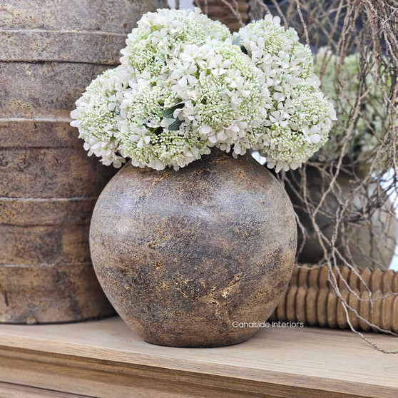 Front view of the Ismara Clay Pot Vessel, highlighting its sculptural round shape and natural clay patina.