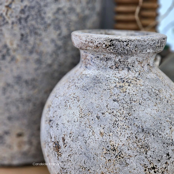 Styled shot of the Elaya vessel filled with white blooms, highlighting the full rounded form and organic texture.