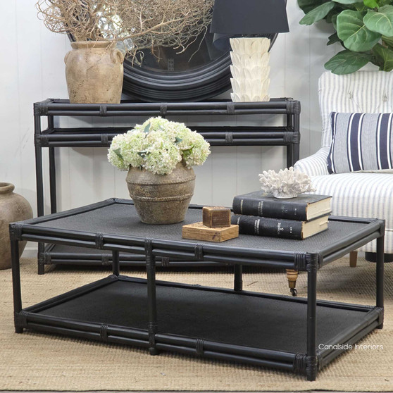 Right-angle view of the Raffles Rattan Coffee Table in distressed black showcasing its bamboo-inspired frame.