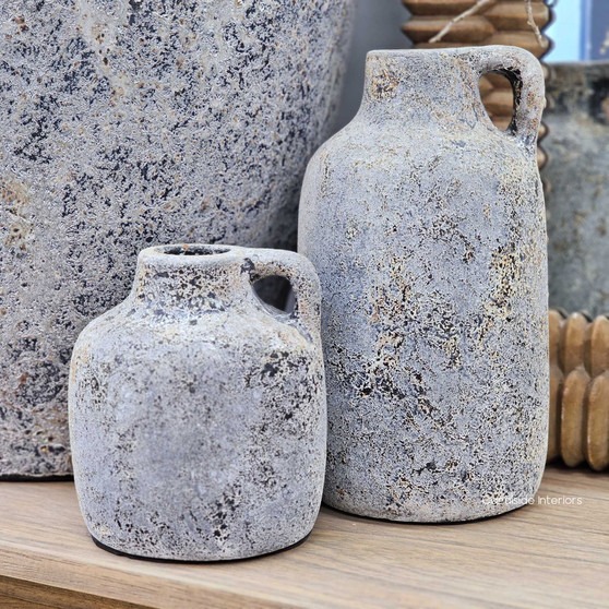 Angled view of the Rana Vintage Bottle Vessels with Handles in stonewash showcasing their aged texture and artisan finish, available in two sizes.