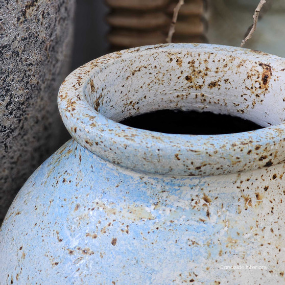 Angled view of the Ismara Pot Vessel in rustic sky finish showcasing its rounded silhouette and soft sky toned patina.