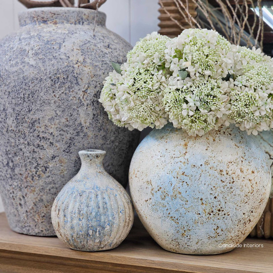 Angled view of the Alba Vessel in rustic sky finish highlighting its ribbed silhouette and sky toned patina.