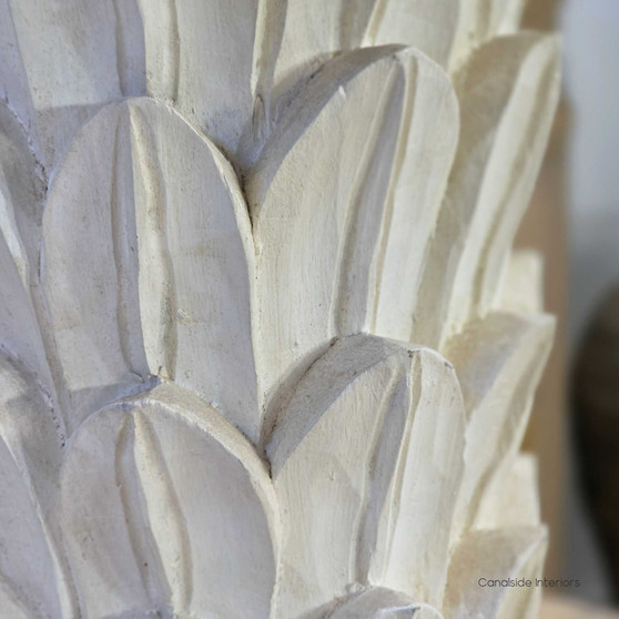 Foliole distressed white hand-carved wooden table lamp with taupe shade on round side table