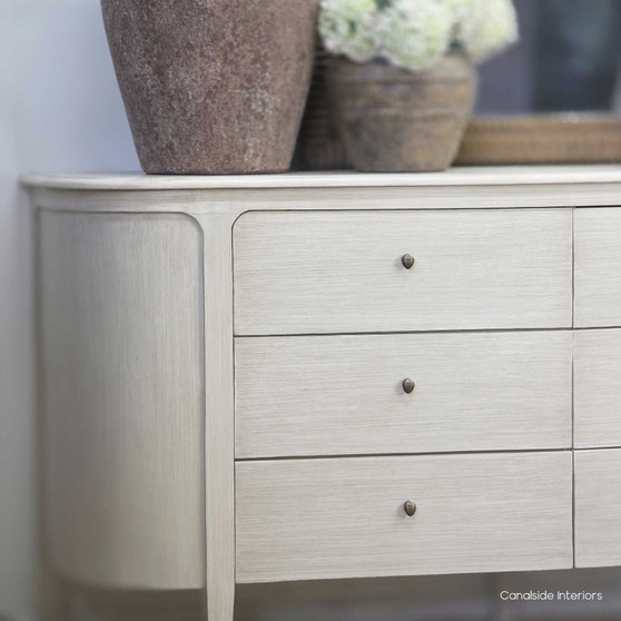 Front view of the Creemore 6 Drawer Chest in stone finish, showcasing its softly curved silhouette, six spacious drawers and hand-finished paint stroke patina.