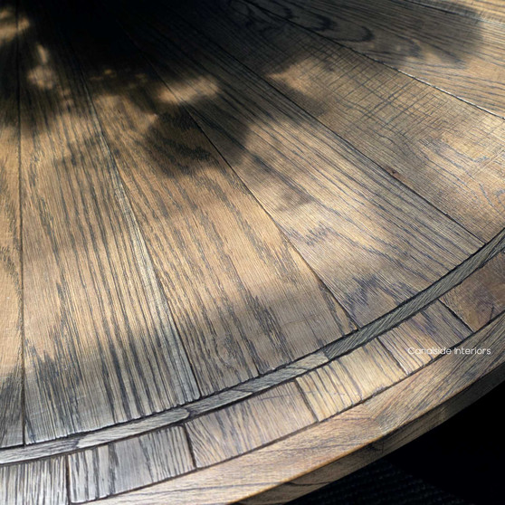 Hand-crafted oak pedestal base of the Danbury table, designed for elegant dining and generous legroom.