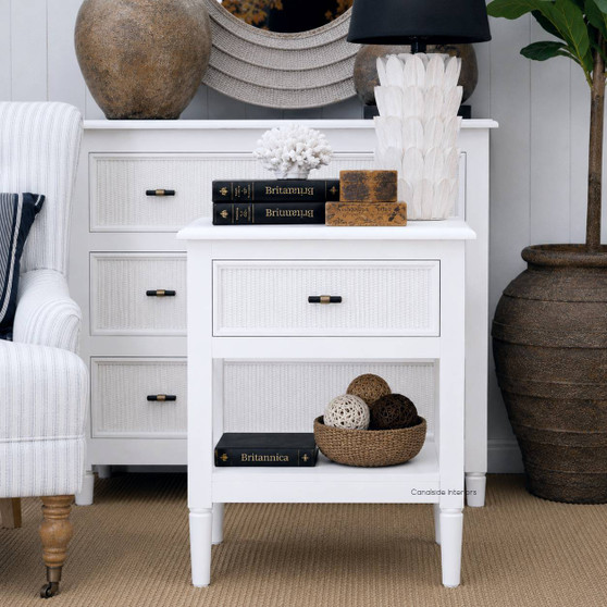 Angled view of the Brielle Rattan 1 Drawer Bedside in white showing the tapered legs, clean joinery and refined proportions in a Hamptons style interior