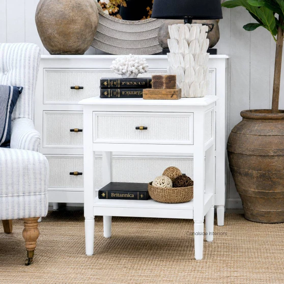 Angled view of the Brielle Rattan 1 Drawer Bedside in white showing the tapered legs, clean joinery and refined proportions in a Hamptons style interior