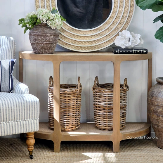 Lexington Demilune Rattan Console Table in Weathered Oak featuring elegant curved ends and natural woven rattan shelves.