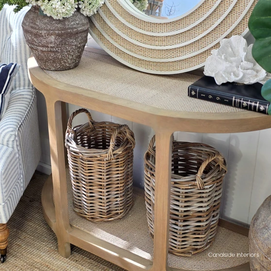 Lexington Demilune Rattan Console Table in Weathered Oak featuring elegant curved ends and natural woven rattan shelves.