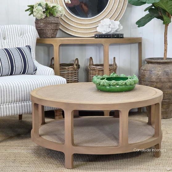 Lexington Round Rattan Coffee Table in Weathered Oak featuring a woven rattan tabletop and matching lower shelf.