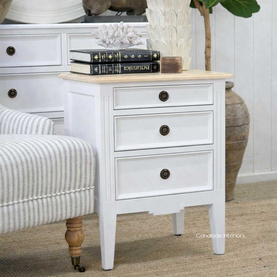 Angled view of the Elegant Peninsula Bedside Table featuring a white finish with a limewash top, perfect for adding coastal charm to any bedroom.