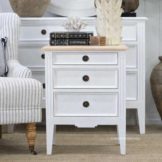 Angled view of the Elegant Peninsula Bedside Table featuring a white finish with a limewash top, perfect for adding coastal charm to any bedroom.