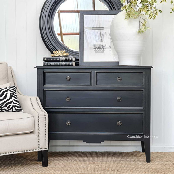Frontal view of the Peninsula 4 Drawer Chest in black, showcasing its understated charm and spacious storage.