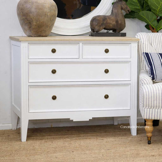 Angled view of the Peninsula 4 Drawer Chest in white with limewash top perfect for any timeless bedroom
