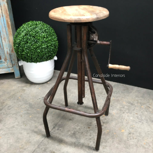 Cruz Adjustable Industrial Stool with a practical winding handle, perfect for adding a modern, artisanal touch to your Canalside Interiors dining room setting