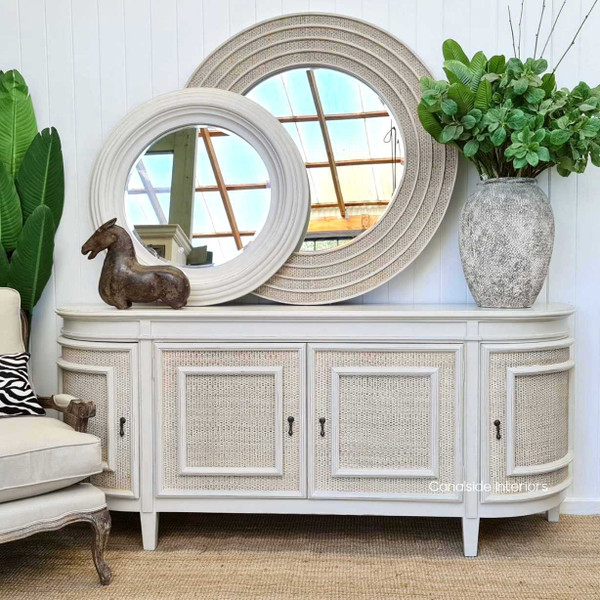 The distressed stone Francia Sideboard with washed rattan is the epitome of Canalside Interiors' Hamptons chic, perfect for adding a classic touch to your bedroom