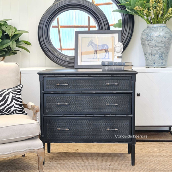 The Brielle Rattan Chest in distressed charcoal/black, showcasing a British Colonial and Hamptons fusion for a timeless bedroom aesthetic