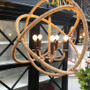 This Lannister Rope Orb Chandelier 72cm with rusted bronze metal exudes coastal elegance, making it a statement piece in a Canalside Interiors styled bedroom